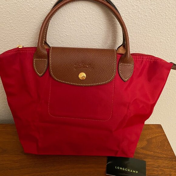 Longchamp Handbags - Authentic Longchamp Le Pliage Bag Small Leather Trim Top Handle Berry Color NEW